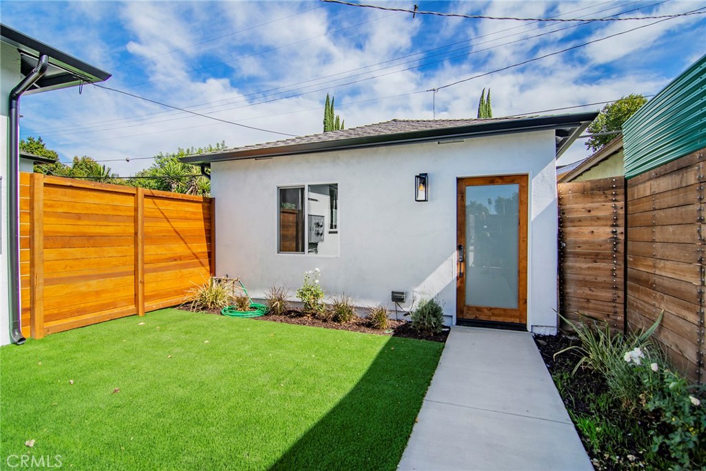 Welcome to this detached 1 bed, 1 bath guest house (ADU) with its own address located in Reseda. This home features a private gated entrance with off street parking. The front yard has the perfect amount of privacy and space for extra storage. Enter into the living room which boasts an open floor plan and leads directly into the kitchen with new cabinets and stainless steel appliances. Beautiful vinyl flooring runs throughout the home which also features in unit washer/dryer, tankless water heater, HVAC system and recessed lighting. The bathroom includes a beautiful shower and recessed lighting. This unit wont last long, call to schedule a showing today.