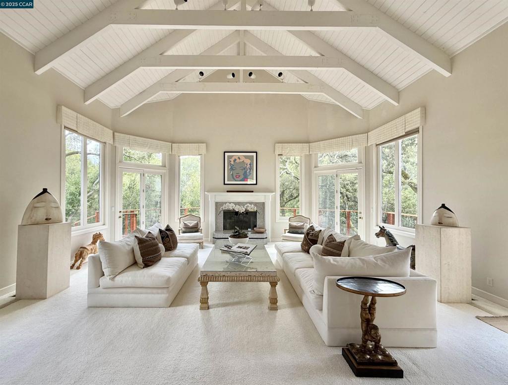 Gorgeous custom estate located on the most exclusive street in the popular gated community of Sanders Ranch. Striking floorplan with impressive entry, soaring ceilings, walls of glass and a dramatic living room with three sets of glass doors, transom windows, gas fireplace and direct access to the backyard make this home a dream for entertaining or day-to-day living. The light-filled elegant office with serene views and a full bath are conveniently located on the same level of the residence. The formal dining room is very comfortable for large or small size gatherings. The kitchen boasts an island, white cabinetry and breakfast nook. The family room is adjacent to the kitchen and provides direct access to the back deck. The generous primary suite features a fireplace, private deck, walk-in closet and a luxurious bathroom with jacuzzi tub. Enjoy this beautiful and peaceful property with lovely views of oaks and surrounding hills, total privacy and convenience of being close to town, great parks, hiking & biking trails and top-rated Moraga public schools.