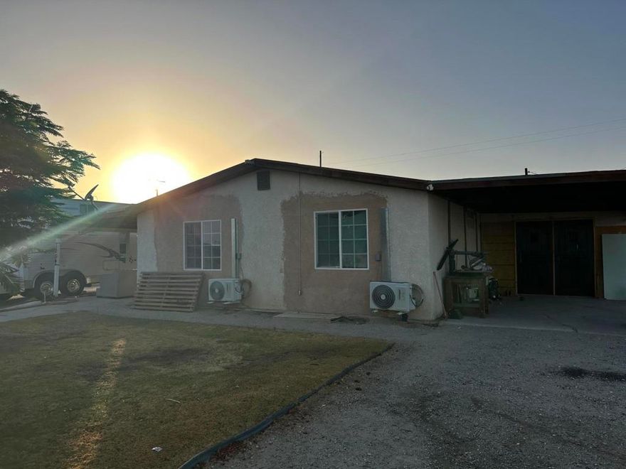 Spacious 4 bedroom 2 bath Manufacture home includes an extra room that may be used for extra bonus room, indoor laundry room, over 10,000 Sq Ft lot completely fenced in.