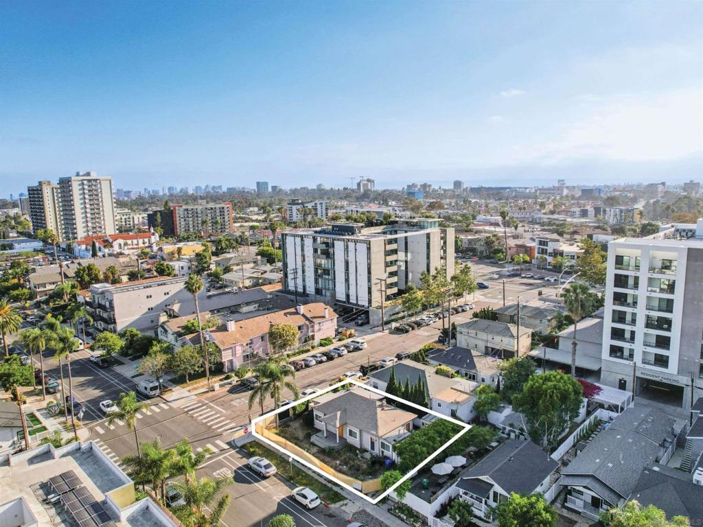 4104 Georgia Street presents a rare, shovel-ready opportunity to develop 14 residential units in the heart of Hillcrest—one of San Diego’s most vibrant and supply-constrained neighborhoods. Situated on a ±3,766 square foot lot, the site is fully entitled and permit-ready, with approved plans for a 7,552 rentable square foot, four-story building featuring a mix of eight one-bedroom and six two-bedroom units. The project falls under the City’s Complete Communities Tier 3 program, allowing a 6.5x FAR with no parking requirement, maximizing density and walkability. It includes one very-low-income unit, making it eligible for CTCAC/HCD incentives and other affordability bonuses. The entitlement package also features transportation-related amenities like co-working space and an on-site bike repair station, enhancing compliance and tenant appeal. Located just minutes from Balboa Park, Scripps Mercy Hospital, the San Diego Zoo, and the nightlife of Hillcrest and North Park—with easy access to I-805 and SR-163—the property offers immediate redevelopment potential in one of San Diego’s strongest rental corridors.