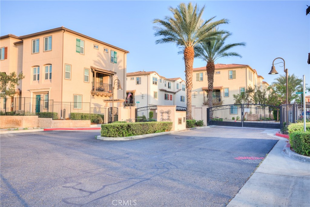 Beautiful 2016 Built - End Unit in the Gated Nexus Community by William Lyon Homes... This beautiful Tri-level End Unit home features 3 bedrooms, 2.5 bathrooms, Plus a den and 2-car attached garage. The entry level has direct access to the 2 car garage and boasts a beautiful den area which is being used as an office area. The second floor is an open concept with a large Living room, Dining room, kitchen with Granite counters, large island, white cabinetry and stainless steel appliances, and a private balcony to relax with your favorite drink. Also a convenient 2nd floor half bath. Located on the 3rd floor is the master bedroom , bathroom and a walk in closet, 2nd and 3rd bedrooms, a full bathroom and convenient laundry area. Enjoy the community pool, spa, playground and barbecue area. Walk able distance to the 24 Hours Fitness, Shops and Restaurants. Easy access to the 15 freeway and centrally located between the 60 and 91 freeways. Brand New Refrigerator, washer & dryer are included.