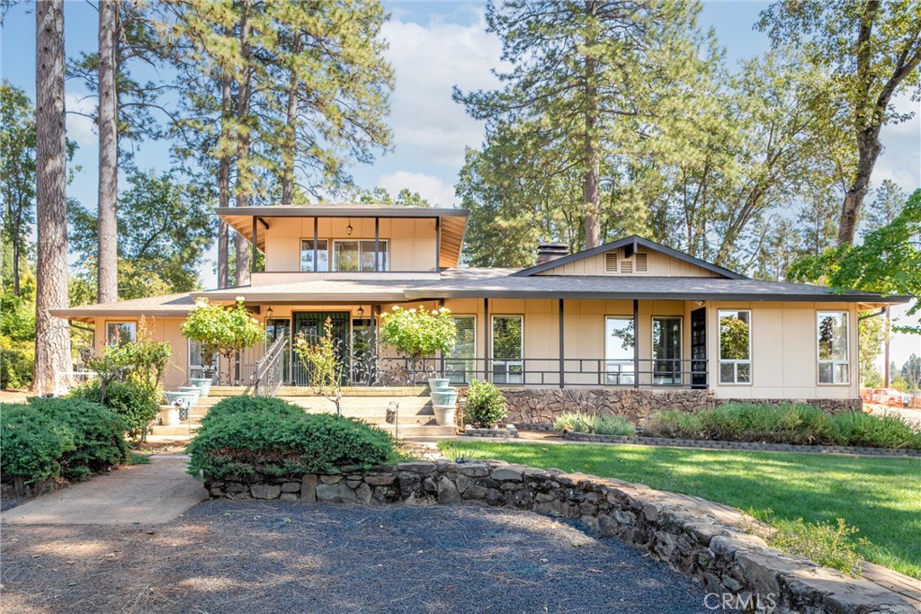 Welcome to this spacious 3,021 sq. ft. home on 2.61 acres in the heart of Paradise. Originally built in 1947 and thoughtfully expanded with additions likely in the 1970s, this two-story residence blends vintage character with modern updates and versatile living spaces. Inside, you’ll find 4 bedrooms and 3 bathrooms, beautiful hardwood floors, and a remodeled kitchen with granite countertops, a cozy eating area, and an extra room. The layout also offers a formal dining room, living room, family room, den, office, laundry room, and an enclosed patio room. Outdoor living is a highlight here, with a welcoming front porch, a relaxing screened-in back porch, plus expansive front and back decks, gazebo, and pergola—perfect for entertaining or simply enjoying the peaceful setting. The property is equipped with both public water service for the home and a well with a sprinkler system for the landscaping. Additional amenities include a detached 3-car garage, carport, storage basement, 5 outbuildings, and extensive parking areas. A whole-house generator provides peace of mind. Adding to its history, the property once included a cottage and duplex that were lost in the fire, leaving potential for future possibilities.
Don’t miss this rare chance to own a piece of Paradise with space, history, and character.