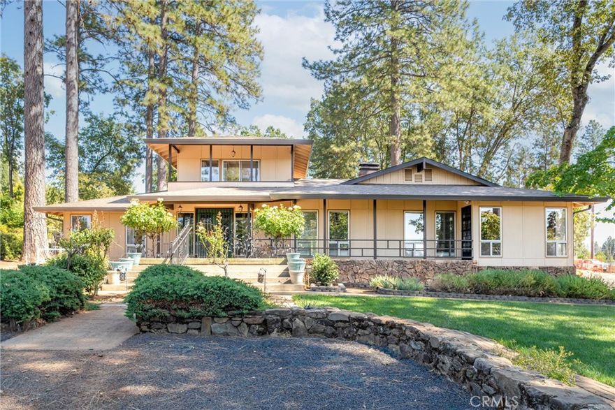Welcome to this spacious 3,021 sq. ft. home on 2.61 acres in the heart of Paradise. Originally built in 1947 and thoughtfully expanded with additions likely in the 1970s, this two-story residence blends vintage character with modern updates and versatile living spaces. Inside, you’ll find 4 bedrooms and 3 bathrooms, beautiful hardwood floors, and a remodeled kitchen with granite countertops, a cozy eating area, and an extra room. The layout also offers a formal dining room, living room, family room, den, office, laundry room, and an enclosed patio room. Outdoor living is a highlight here, with a welcoming front porch, a relaxing screened-in back porch, plus expansive front and back decks, gazebo, and pergola—perfect for entertaining or simply enjoying the peaceful setting. The property is equipped with both public water service for the home and a well with a sprinkler system for the landscaping. Additional amenities include a detached 3-car garage, carport, storage basement, 5 outbuildings, and extensive parking areas. A whole-house generator provides peace of mind. Adding to its history, the property once included a cottage and duplex that were lost in the fire, leaving potential for future possibilities.
Don’t miss this rare chance to own a piece of Paradise with space, history, and character.