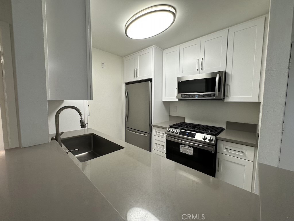 Renovated in 2023, this desirable condo in Parc Tarzana located just minutes to Ventura Blvd, shops, restaurants and the 101 freeway access. This first floor unit offers a sought after dual master floor plan, an updated kitchen with quartz counters, stainless steel appliances, vinyl flooring throughout and a private fenced patio perfect for entertaining. One bedroom features a bathroom with a bathtub while the other bedroom has a standup shower. Each bedroom has a split AC system that is independent from the others. The unit has one tandem parking space on the second floor of the parking garage that can accommodate up to two cars. Take advantage of the low HOA and the amenities that include a pool, a Recreation room, a laundry community room and a courtyard with mature trees which surround the property. Seller is motivated.