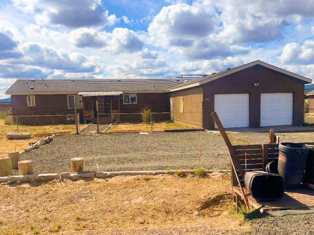 Welcome to 602 Dana Rd in Alturas! This 4-bed, 2-bath home offers a mix of comfort, income opportunity, and outdoor living. Currently producing approx. $2,000/month from 2 rooms as an Airbnb, the home also features a fenced yard, seasonal creek, chicken coop, and a redone backyard deck with relaxing creek views. HOA is paid annually with benefits including pool, garbage, fire services, pest control,lodge, and restaurant/bar/hotel. Surrounded by Modoc National Forest, enjoy fishing, hunting, birding, and local festivals. Perfect for full-time living, retreat, or investment.