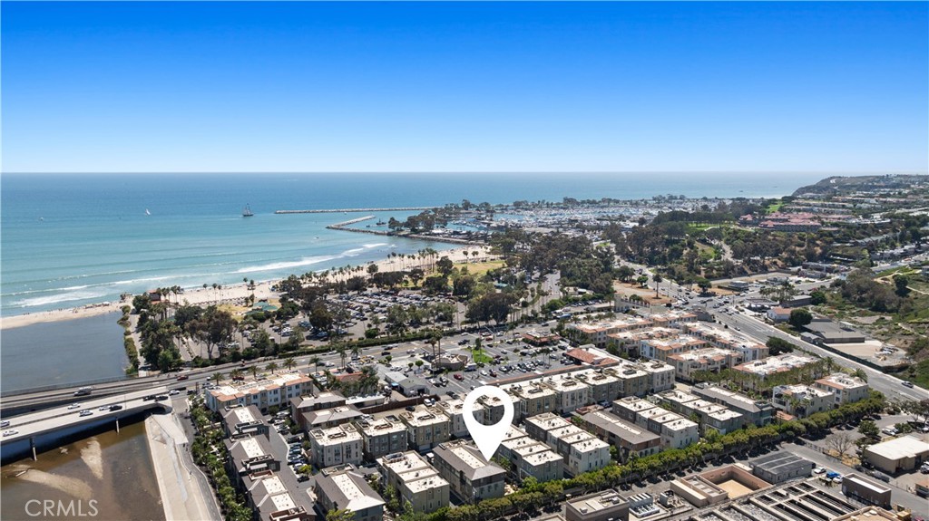 Welcome to South Cove, a modern coastal enclave just a five-minute walk from the sand at Doheny Beach. This former model home offers 2 bedrooms, 2.5 bathrooms, and over 1,500 square feet of thoughtfully designed living space. Built in 2021, it blends beachside convenience with contemporary comforts.
Inside, you'll find custom tile work, motorized electric blinds throughout, and a bright, open-concept main level that includes the kitchen, living area, and a half bath, perfect for entertaining. Upstairs, both bedrooms feature en-suite baths for added privacy and comfort.
Downstairs, the rare 3-car tandem garage includes an EV charger and room for ample storage. Enjoy ocean breezes from your private patio, or head over to the resort-style community pool.
The Dana Point Harbor, just a 10-minute walk, is undergoing a $600 million revitalization, set to be a premier Southern California destination by 2027.
This home is eligible for 30-day rentals and has been successfully rented in the past, offering flexibility as a primary residence, second home, or income-producing beach retreat. Furnishings can be included.