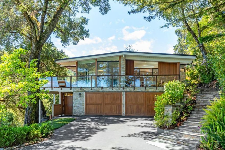 Contemporary luxury with breathtaking San Francisco Bay views in Central Woodside. Extensively renovated open concept design on two levels, including modern kitchen, white oak floors, new metal roof, and designer baths. Tesla solar power, 5 battery backups, EV charging, and synthetic lawn. Every room opens to a deck for Bay or western hill views or just the natural beauty of the surrounding grounds. Elevated and private pool plus meditation/yoga area with sweeping views. Separately fenced farm with large barn and space for animals or garden. Direct access to hiking and equestrian trails at Wunderlich County Park. Excellent Woodside Elementary School (K-8). Recent upgrades over 500K of improvements including new standing seam metal roof, solar system & storage, HVAC systems, structural upgrades, plumbing, home A/V systems. Every detail updated and ready to be enjoyed!