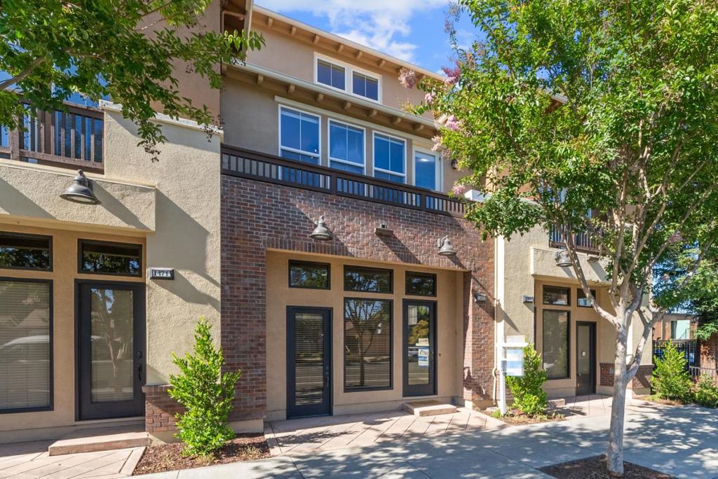 This exceptional villa in the Village Square enclave of San Jose offers an inspired blend of functionality, finishes, and location. Built in 2008, this spacious 3 bed, 3 bath residence spans 1,647 sqft over three thoughtfully designed levels. The main level features a versatile bonus room, perfect for home office or live/work flexibility, with direct access to a covered porch. Upstairs, find an open-plan living/dining area, chefs kitchen with island, granite counters, and stainless appliances. Enjoy high ceilings, recessed lighting, and wide plank floors throughout. The top floor hosts two primary suites, each with walk-in closets and luxurious en-suite baths. Outside, unwind on private decks or take advantage of the Village Square amenities: green spaces, childrens play areas, and picnic grounds. Monthly HOA just $460. Located in the charming Rose Garden / West San Carlos neighborhood, the home is just moments from Santana Row, Diridon transit hub, shopping, dining, and future Google Village. Dont miss this rare opportunity to have a beautiful, low-maintenance home with built-in work flexibility in a vibrant, walkable San Jose community.