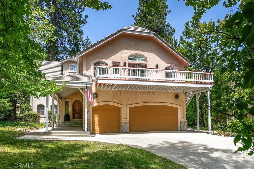 Dockside Dream at Meadow Shores!
Looking for one of the best values in Lake Arrowhead with a dock slip included? Look no further—this is the lake escape you’ve been waiting for! With a major price improvement, this timeless mountain retreat in the exclusive gated community of Meadow Shores is now a can’t-miss opportunity.
Tucked among mature trees and storybook landscaping, this charming four-bedroom home offers the perfect blend of comfort, character, and lake life magic. Just a short walk or scenic golf cart ride away is your very own dock slip, nestled in the calm, protected waters of Meadow Bay—ideal for peaceful mornings on the lake or sunset cruises with friends.
Upstairs, discover four cozy bedrooms, all thoughtfully arranged on one level. The spacious primary suite feels like a true sanctuary, featuring vaulted tongue-and-groove ceilings, a dual-sided fireplace, two walk-in closets, an attached office, and a private redwood deck—perfect for your morning coffee among the pines. Two of the guest rooms share a Jack-and-Jill bathroom, and there's even a large laundry room with storage galore.
Downstairs is made for gathering—with a wide-open floorplan, durable tile and slate flooring, and a flow that brings everyone together. The heart-of-the-home kitchen boasts custom oak cabinetry, a Wolf range, KitchenAid refrigerator, and walk-in pantry, while the adjacent dining room is perfect for hosting unforgettable lake weekend dinners. A dual-sided fireplace warms both the den and living room, and sliding doors open to your backyard patio and BBQ space—ready for summer grilling and starlit evenings.
Bonus features include an attached three-car garage, two brand new forced-air heaters, central vacuum, and built-in garage storage.
Whether you're searching for a full-time haven or the ultimate lake house getaway, this home delivers all the Lake Arrowhead vibes with comfort, space, and your own dock to match.