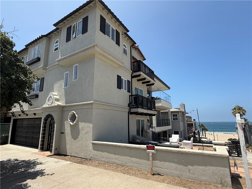 Live the Ultimate Beach Lifestyle in Manhattan Beach’s Coveted Sand Section
Welcome to this beautifully situated coastal residence, just steps from the sand in the highly sought-after Sand Section of Manhattan Beach. This multi-level home perfectly captures the essence of California beach living, offering inviting outdoor spaces, multiple balconies, and breathtaking ocean views right outside your door.
From its classic architectural charm to the sunlit patios and balconies, designed for relaxation or entertaining, this home embodies the laid-back luxury of the beach lifestyle. Inside, you’ll find an expansive interior that serves as a blank canvas—ready for your vision and redesign. Whether you dream of creating a contemporary coastal retreat or a warm traditional haven, the possibilities are endless.
Imagine hosting sunset gatherings with friends or taking strolls down the picturesque walkway that leads directly to the sand. With unmatched walkability to the beach, the vibrant downtown area, you’ll have boutique shopping, renowned restaurants, and lively local events just minutes away.
