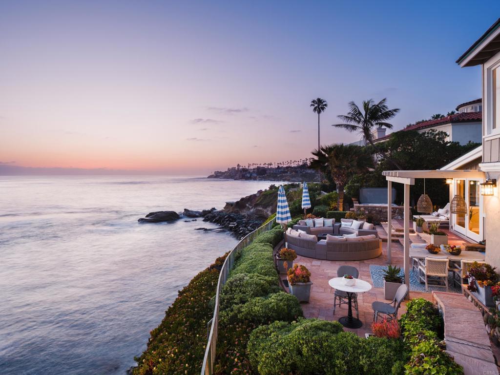 Positioned prominently above the iconic rock that is the namesake of one of La Jolla’s favorite neighborhoods, the house at Bird Rock has an incredibly desirable combination of features. It offers panoramic, front row views with a bird's eye perspective of the vibrantly colorful and ever changing ocean below, and an orientation that perfectly frames the surf breaks and mesmerizing sunsets, all from a location in close proximity to the charming allure of the restaurants, shops, galleries and neighborhood amenities of Bird Rock. The floor plan includes an upstairs primary suite with breathtaking ocean views, 4 secondary bedroom suites, a powder bath and 2 offices, and an oceanfront patio with multiple sitting areas and jacuzzi spa. The home is great for entertaining and enjoys a laid back yet luxurious feel that exceeds expectations set by the understated curb appeal. The site has one of the most robust and permitted retaining earth walls in the area that supports the land on the ocean side, which adds to the usable outdoor space and ensures peace of mind not always enjoyed from properties of this kind. Being adjacent to a stairwell down to the water provides the best of all worlds - bluff top views, secure privacy for a beach location, and easy access to all of the natural wonders of the ocean below. Homes with the lifestyle features that are appurtenant to this property are scarce and the value of such a limited offering cannot be measured in dollars alone.