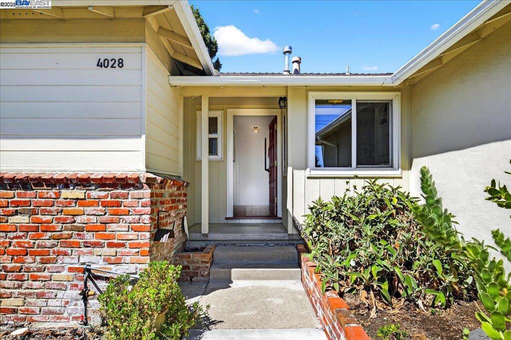 Don't miss this charming and thoughtfully maintained home, a true gardener's paradise! The professionally landscaped front yard features a bounty of mature plantings including Fuyu persimmon, Japanese maple and manzanita trees. The backyard continues the theme with additional persimmon trees, a fig tree, succulents, and a covered patio—perfect for relaxing or entertaining in your private outdoor retreat. Inside, you'll find refinished hardwood floors and a freshly painted interior that create a warm, inviting atmosphere. The cozy living room features a classic wood-burning brick fireplace, built-in bookcase, and is complemented by a beautiful wood paneled front door. The kitchen boasts a reverse osmosis water filtration system, and the home has both an eat-in and formal dining area. The spacious primary bedroom suite offers comfort and privacy, while the attached garage provides ample storage with built-in cabinets. Conveniently located near Marshall Elementary, the Castro Valley library, shopping, restaurants, BART, and more!