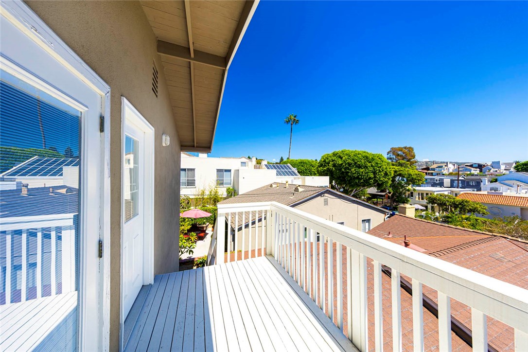 Tucked away at the quiet end of Iris Avenue beside Grant Howald Park, this home features a 2-bedroom, 1-bath home on the upper level with a studio/flex space below. Filled with natural light, it features a spacious kitchen with generous storage as well as a private balcony to enjoy the neighborhood views. The lower-level studio, approximately 400 square feet, includes laminate flooring, a kitchenette, and a full bath, making it ideal for an office, art studio, or similar use. Set in a prime Corona del Mar location, the property is just minutes from beaches, shopping, parks, athletic facilities, top-rated schools, and acclaimed restaurants.