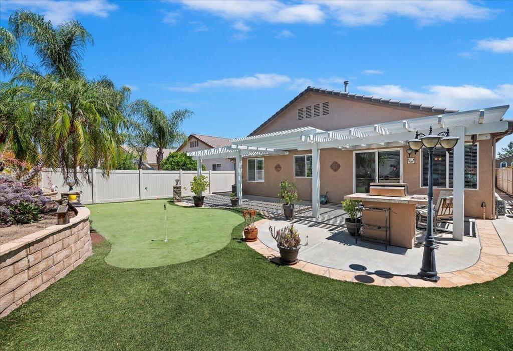 Resort-Style Living in The Oasis - Premier 55+ Community in Menifee Welcome to your dream home in the highly sought-after Oasis community, where resort-style living meets everyday comfort. This beautifully maintained single-story home offers 2 bedrooms, 2 bathrooms, plus a versatile den, and spans an impressive 2,091 square feet of thoughtfully designed living space.In the heart of the home--a chef's kitchen featuring an oversized granite island, abundant cabinetry, and a large pantry. The open-concept layout seamlessly connects the kitchen to the dining area and expansive great room, perfect for entertaining or simply relaxing in style.Retreat to the luxurious primary suite, complete with an ensuite bath that includes a soaking tub, dual sinks, and a generous walk-in closet.Outside, enjoy your private backyard oasis, professionally landscaped for low maintenance. Entertain guests under the full-length Alumawood patio cover, fire up the built-in gas grill, or work on your short game on your very own Putting Green!Living at The Oasis means access to a 22,500 sq. ft. clubhouse, offering a lifestyle second to none. Enjoy the Olympic-size pool and spa, tennis and pickleball courts, bocce ball, shuffleboard, and more. Stay active in the fully equipped fitness center, or socialize in the card room, library, billiards room, or spacious ballroom, which hosts regular concerts and events.For golf lovers, the community is surrounded by the Menifee Lakes Country Club, a Ted Robinson-designed 36-hole course.With low taxes, HOA-covered front yard maintenance, trash, security, and a manned gate, this home offers both luxury and peace of mind. Located close to major shopping, dining, medical facilities, and wineries--with easy access to transportation--The Oasis is the perfect place to enjoy the next chapter of your life.Come visit The Oasis in Menifee and discover what resort-style 55+ living is all about!