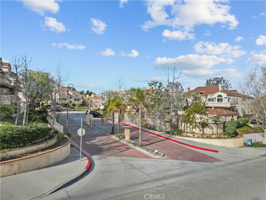 Live the good life in this beautifully upgraded 3-bedroom, 2-bath + spacious loft upper-level corner-unit condo in the highly sought-after gated community of Sierra Glen! From the moment you walk in, you're welcomed by soaring vaulted ceilings, brown-painted exposed wood beams, and abundant natural light that fills the open and airy layout. The home features premium hardwood-like flooring throughout the main living areas and all bedrooms, creating a clean, cohesive, and modern feel.



Enjoy a cozy fireplace with a gorgeous stone wall surround, a stylish stone accent wall along the staircase, and a versatile loft perfect for a home office, guest room, or creative space. The kitchen and bathrooms feature elegant tile flooring for durability and style. The primary bedroom features a walk-in closet and direct access to a full bathroom, while two additional bedrooms and a second full bathroom offer comfort and flexibility.



Relax on your private patio with peaceful city lights and community views, and take advantage of your rare side-by-side 2-car garage with extra storage. The VA-approved Sierra Glen community includes a pool and spa, and is ideally located near the 14 Fwy, shops, gyms, dining, and top-rated schools. This home truly has it all—space, upgrades, location, and charm. Don’t miss your chance to make it yours!
