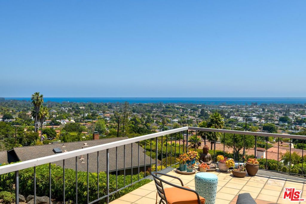 VIEWS VIEWS VIEWS Unobstructed vistas of ocean, islands, harbor and city lights from this home at the end of a quiet cul de sac just down the road from the Santa Barbara Bowl. The entry level is comprised of 3 bedrooms and 2 bathrooms, open kitchen with adjoining dining which shares a dual faced fireplace with the spacious living room. All public rooms have sliding glass doors leading to expansive deck with plenty of room to add outdoor kitchen or BBQ. Lower level has 2 extra rooms running the entire length of the house, Lower level leads to good sized backyard. Additional rooms and yard also enjoy good views. Potential for dual living or excellent master suite with addition of an additional bathroom. Enjoy customizing or live in as is. Brand new roof installed earlier this year.