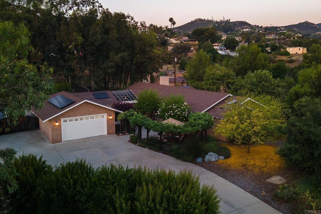 BEAUTIFULLY REMODELED 3 BEDROOM + DETACHED OFFICE/POTENTIAL ADU, 2.5 BATH, 2605 SQ FT SINGLE STORY VIEW HOME ON .86 OF AN ACRE, LOCATED IN THE HIGHLY SOUGHT AFTER SHADOW MOUNTAIN AREA OF EL CAJON AND THIS ONE IS LOADED, INCLUDING PAID FOR SOLAR, STUNNING KITCHEN WITH CENTER ISLAND, BREAKFAST BAR, GRANITE COUNTERS, STAINLESS APPLIANCES, POT FILLER, FARM SINK, DOUBLE OVEN AND WARMING TRAY, OPEN FLOORPLAN VERY LIGHT AND BRIGHT WITH LOTS OF WINDOWS, LARGE LIVING ROOM WITH EXPOSED WOOD VAULTED CEILINGS, RECESSED LIGHTING, FRENCH DOORS, DUAL PANE WINDOWS AND SLIDERS, CEILING FANS, RAISED PANEL DOORS, SPACIOUS GUEST BEDROOMS WITH A REMODELED JACK AND JILL BATHROOM, LIVING ROOM WITH CUSTOM BUILT-INS, HUGE PRIMARY BEDROOM WITH A WALK IN CLOSET WITH CUSTOM BUILT-INS, REMODELED PRIMARY BATH WITH A DUAL VANITY ALONG WITH SEPARATE TUB AND A WALK-IN TILE SHOWER, DETACHED ROOM THAT IS CURRENTY BEING USED AS AN OFFICE THAT COULD BE A 4TH BEDROOM OR ADU, THERE IS A HUGE 3+ CAR GARAGE WITH HIGH CEILINGS THAT IS APPROX 946 SQ FT ALONG WITH A DRIVE THROUGH GARAGE DOOR IN THE BACK, BEAUTIFULLY LANDSCAPED WITH MATURE TREES, MULTIPLE PATIO AREAS, HUGE COMPOSITE DECK, ROOM FOR A POOL, LOADS OF EXTRA PARKING, LONG DRIVEWAY, INCREDIBLE PRIVACY AND MUCH MORE.