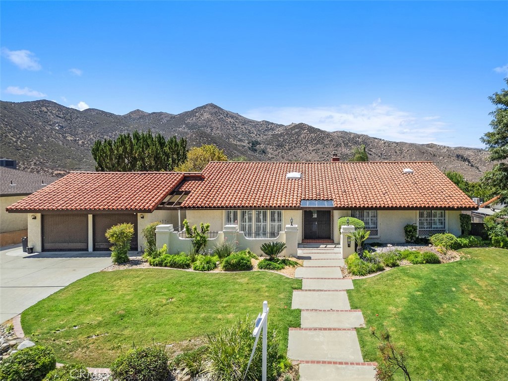 Spanish Hacienda Retreat in East Hemet
Tucked away in unincorporated East Hemet, this Spanish-style hacienda offers the perfect blend of privacy, charm, and convenience. Nestled among citrus groves and an enclave of semi-custom homes, this property is more than a house—it’s a lifestyle.
Step inside to find warm terra cotta tile floors, soaring beamed ceilings, and a bright open-concept kitchen, dining, and great room designed for gatherings and unforgettable moments. From here, take in sweeping hillside and citrus grove views that bring the outside beauty in.
The step-down living room offers an inviting retreat—ideal for curling up with a book, relaxing with friends, or enjoying quiet conversation.
Outdoors, enjoy your own private oasis: a sparkling in-ground pool, outdoor fireplace, and expansive hardscape perfect for entertaining or simply soaking in the serenity.
Additional highlights include:
Owned solar for energy savings
Zoned heating & air with three zones
Propane gas stove + dual electric ovens
Peaceful. Private. Picture-perfect. Only a personal tour can truly capture the charm and tranquility of this neighborhood and home.