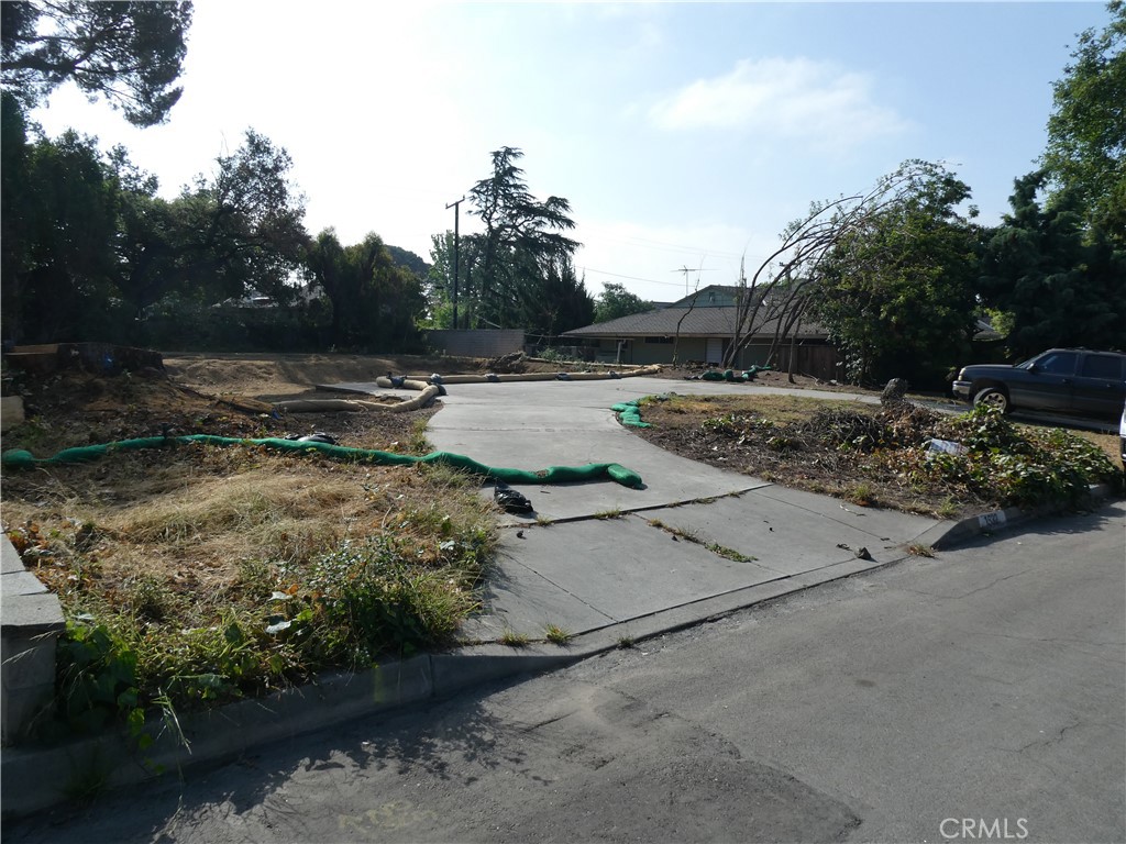 Large vacant lot on beautiful cul-de-sac street. Property has been cleared of any standing structure and received "Final Sign-Off" for both Phase I and Phase II by USACE. Only this lot and one across the street lost structures. Remainder of street and cul-de-sac are all standing, for the most part. Property being sold as-is. Utilities previously connected. Buyer to verify availability of utilities with local providers. Buyer to conduct its own due diligence, as Buyer deems necessary and prudent, into all aspects of the Property for rebuilding, zoning, environmental and health risks, lot lines, existing septic system, etc.