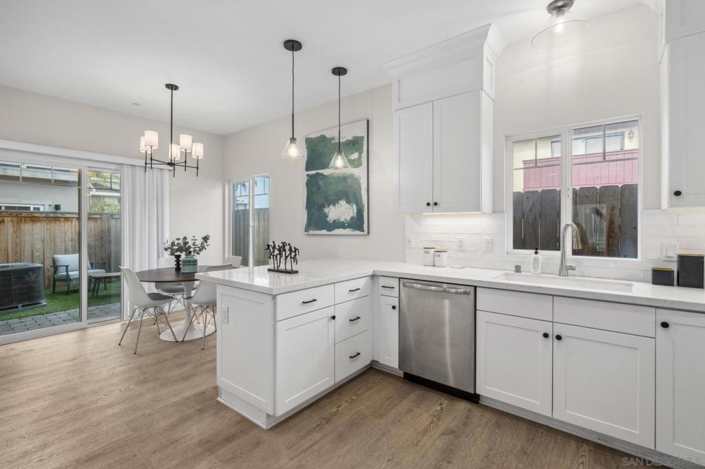 VA Approved and the best value in 91932! This Craftsman-style townhome, built in 2022 and just 5 minutes from the beach, features premium finishes and designer touches throughout. Enjoy a private, low-maintenance patio plus a second-floor tanning balcony—perfect for indoor-outdoor living. The oversized 2-car attached garage includes an EV outlet and plenty of storage. Inside, the open-concept layout boasts high ceilings, durable vinyl wood-look flooring, and a spacious primary suite with walk-in closet and en-suite bath, located near a full-size laundry room with side-by-side washer and dryer. Additional upgrades include a Wi-Fi-enabled HVAC thermostat, energy-efficient tankless water heater, and a solar-ready setup so buyers can choose their own provider and potentially benefit from tax incentives. Don’t miss the 3D Matterport tour and marketing video in the Virtual Tour link—this one won’t last! Who would have thought that so much was available at such a low price and only a 9 min bike ride to the water?! The Craftsmen style design fits perfectly into our Southern California landscape. This 8-unit complex was completed in 2022, making it newer construction. Exceptional attention has been paid to all of the details that make daily living effortless and inspiring. The windows are by the highly regarded manufacturer Milgard and allow for an abundance of natural light, creating a bright and inviting atmosphere. Upon entry you feel the contemporary flair, from the wide-plank, oak engineered wood floors, to the high ceilings and custom finishes. The kitchen is a dream unto itself, as it features a full suite of Frigidaire stainless-steel appliances and an abundance of cabinetry and food prep quartz counter space, complete with breakfast bar. The bedrooms are all generously sized with the primary suite being exceptional, featuring a large walk-in closet and dual sink primary bath with large walk-in shower. You will love the separate laundry room, located on the same level as the bedrooms, with its side-by-side Whirlpool washer and dryer, overhead cabinetry and wonderful window for additional ventilation and light.