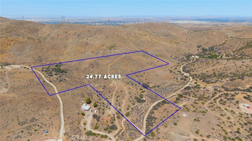 Incredible Opportunity in Acton – 24.77 Acres of Potential!  Nestled between stunning mountain views, this expansive 24.77-acre lot offers the perfect canvas to build your dream home. Located in a desirable area surrounded by custom homes, there’s plenty of space for your animals, recreational vehicles, or future expansion. Power is available nearby at the road, and the property is conveniently close to the 14 Freeway for easy access.  Don't miss your chance to create something truly special.  Buyer to independently verify all information.