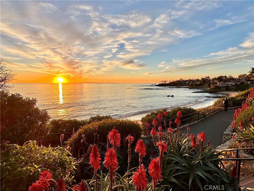Brand new remodeled Cottage/Back House with panoramic Ocean, Catalina, and City Light views in North Laguna, just above Boat Canyon. This charmer is turn-key, was taken down to the studs and rebuilt with all high-end materials, and is just 2 blocks from the beach (Divers Cove, Heisler Park, and Fisherman's Cove). Enter from the back (off alleyway or along private path along East side of 252 Grandview to back) to an open deck surrounded by lemon trees. A wall of windows in the Living Room offers sweeping Ocean Views. High-beamed ceilings and new wood floors create a bright, beachy chic escape with tasteful decor and a large flat-screen TV. The remodeled kitchen has top-of-the-line appliances and is completely equipped with dishware, cookware, coffee machine, etc. for a comfortable stay. Full-sized stackable laundry in Hallway closet, new bathroom with step-in shower and a primary bedroom with a King-sized bed, flat-screen TV and walk-in closet. A/C and Instant Hot Water Heater. There is an outdoor shower for washing off the sand after a relaxing day at the beach. Restaurants and shopping are just steps away at Boat Canyon (Pavillions, ReUnion Kitchen, Grazie Pizza, Jan's Health Bar, Asada Tacos, and Black Dot Coffee) along with Gallery Row and all Village shops. Inquire about availability.