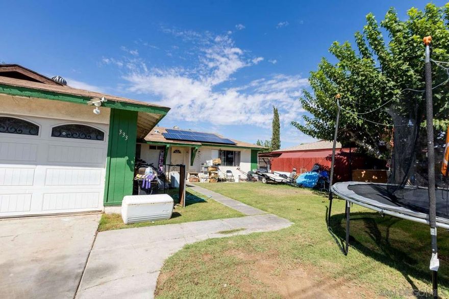 Charming mid-century ranch-style home at 333 N Carlton Ave, Blythe, CA 92225. This 4-bed, 2-bath single-story residence offers 1,200 sq ft on a 6,534 sq ft lot. Features a wide garage with decorative arches, modern solar panels, granite countertops, and spacious front and back yards. Built in 1971, this property blends move-in potential with renovation opportunities for investors or first-time buyers. Ideally located near the Colorado River, schools, and amenities. Priced at $180,000, seize this opportunity in Blythe’s growing market!