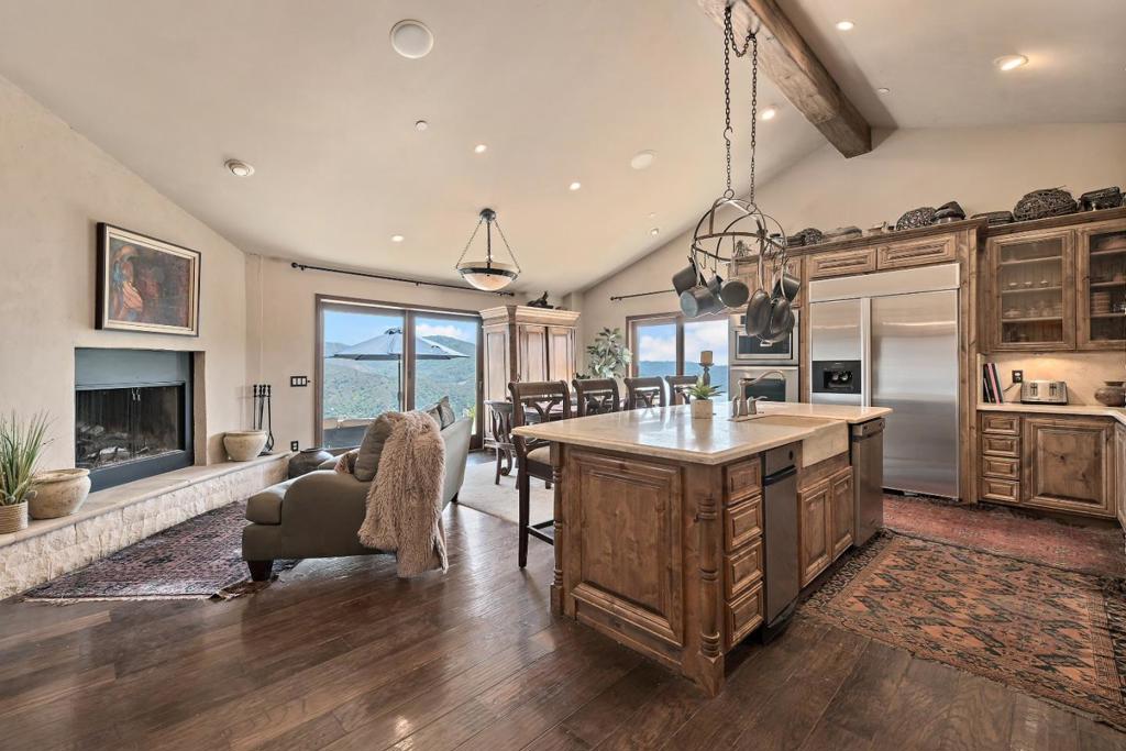 Discover 15 acres of Heaven on top of Montevina Road in the Los Gatos Mountains, just 10 minutes from downtown Los Gatos! Enjoy 360-degree views of the Bay Area, Lexington Reservoir, & Lyndon Canyon, & amazing sunrises & sunsets from your own private oasis. A paved road leads to the gated property, showcasing a gorgeous artist's retreat, with elegant stone & wood finishes. The approx 3 acre fenced area is ready to plant & grow your own vineyard, +an additional 3 acres across the road with potential for another home, or more vineyard acreage. 6 zones are ready to irrigate with accessible water for 1500 of your favorite grape plants. A high-producing well with two 10,000 gal tanks + fire hydrant.The remodeled home has artsy fixtures, stone mosaic wall cladding, knotty pine cabinets, solid core doors, & hardwood floors. Kitchen has a stone island w/seating, chef's quality 6 burner Jade stove, & Thermador oven. A 16 ft wood beam ceiling, & 2 Anderson sliders off family room/kitchen. Equipped with Sonos stereo & home theatre systems. Super insulated temp-controlled wine cellar has stone facing throughout. 2 versatile sheds (W/D & storage+). Plans/Reports for soil, septic, driveway, & easements for use in creating your dream home & infinity pool--$150,000+ value! Top Los Gatos Schools!