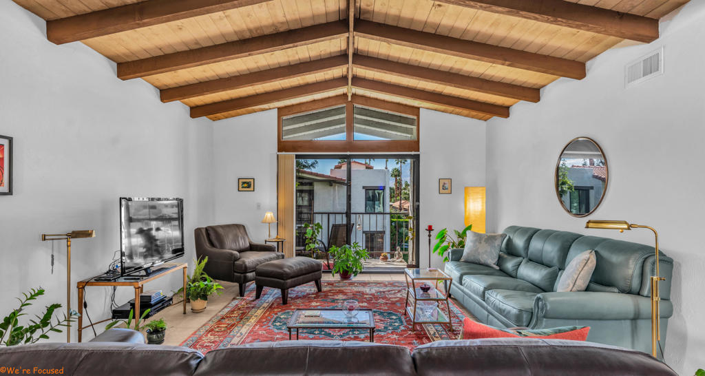 Welcome to the lush, gated community of Ramon Estados, perfectly situated in the heart of Palm Springs. This centrally located gem offers easy access to downtown, shopping, and Palm Springs International Airport. Step inside to discover a bright and airy living space, highlighted by stunning wood-beamed ceilings that lead you to a private balcony with breathtaking mountain views. Freshly painted and featuring a brand-new HVAC system, this home offers both comfort and style. The primary suite boasts a newly remodeled shower, and the bedrooms are fitted with plush new carpeting. Abundant storage ensures everything has its place. There is also a private storage locker along with a place to store your bike. Enjoy the fantastic community amenities, including two tennis courts, two sparkling pools, a pickleball court, a sauna, a gym, and on-site laundry facilities. The clubhouse is currently undergoing renovations, promising even more to look forward to. For added convenience, the community also offers open, uncovered parking. Experience the best of Palm Springs living at Ramon Estados!