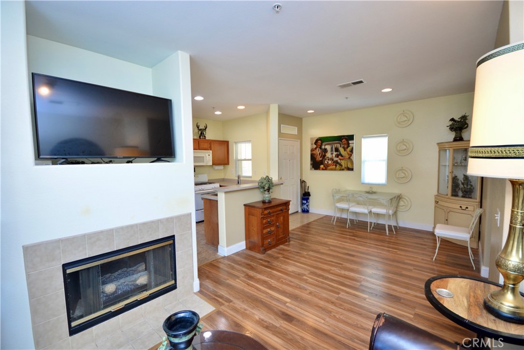 "BEAUTIFUL GATED COMMUNITY." Located in MURRIETA. Come and see this light and bright UPSTAIRS condo offering 1 Bedroom,and DEN that could be converted into a small 2nd bedroom, 1 bath, LIVING room with Fireplace, Kitchen with Breakfast Counter opens up to the outside Balcony for your enjoyment. The Bedroom offers a nice size Walk-in-Closet. INDOOR LAUNDRY Room for your convenience including the Washer and Dryer FRESHLY PAINTED AND BRAND NEW CARPET, TURN-KEY MOVE-IN CONDITION!!!! The Community offers a POOL, SPA, and GYM , FIREPIT and BBQ. Close to Shopping, 215/15 Freeways for easy commute and Award Winning Wineries.