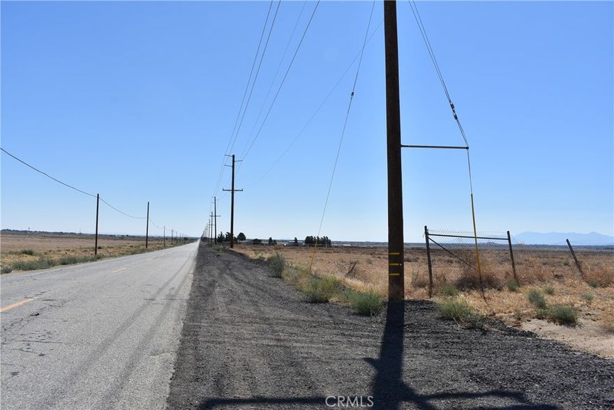 39.25 acre agricultural lot or possible solar farm. Zoned A22 for agriculture, animals, and a home. 1319 feet of paved frontage on Ave J with power in the street. APN 3203-020-019.