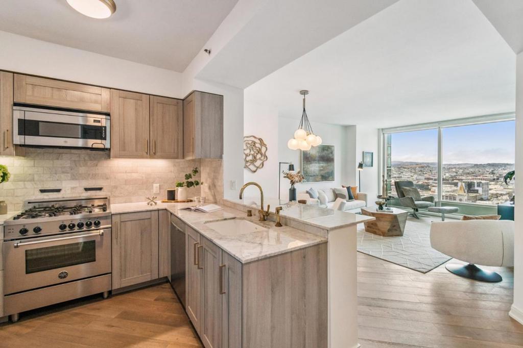 A+ location in Rincon Hill! Welcome to this gorgeous high-floor 1BD/1BA plus office nook with 10 ft floor-to-ceiling windows facing south! Sunny all day long! You will enjoy the panoramic views of city/mountain from all rooms! The Harrison building redefines the luxury! You will be impressed by the sophiscated, modern lobby at the first glance. The best finishes complete this roomy unit, with custom lighting, Oak plank flooring, custom cabinetry, Waterworks copper fixers, Bertazzoni 4-burner gas range, Sub-Zero built-in refrigerator, and Carrara marble countertops. Parking and extra storage space included! The Harrison is renowned for its five-star amenities and top-of-the-line services, including 24/7 front desk, full time concierge, on-site maintenance team, valet parking, fitness center, outdoor heated pool and spa, self-storage and personal wine storage, daily fresh coffee and breakfast bakery, and the famous Uncle Harry's sky lounge with bars on the 49th floor overlooking Bay Bridge.