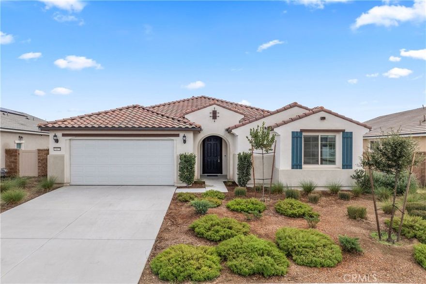 Premium Lot • California Room • Solar • Move-In Ready. Discover exceptional single-story living in the highly desirable Banner Park community in Menifee! This is a desirable community with walking trails and parks. This well-maintained single-story Pulte home offers 2,460 sq ft of living space on a premium 9,700+ sq ft lot. Built in 2021, the property features 3 spacious bedrooms, 2.5 bathrooms, a versatile den (ideal for a home office or optional 4th bedroom), and a tandem 3-car garage providing additional storage or flex space options. The open-concept layout includes a large kitchen with granite countertops, stainless steel appliances, a walk-in pantry, and a center island with a breakfast bar. The adjoining great room is filled with natural light and connects to a covered California room equipped with lighting and a ceiling fan—perfect for outdoor enjoyment. The front and backyard are fully hardscaped for low maintenance, with ample space for a pool, garden, or additional outdoor features of your choice. The home also includes a leased solar system for potential energy savings. Situated on a cul-de-sac and surrounded by other newer homes, this property is move-in ready and offers a spacious layout with modern finishes. Nearby Pulte new construction homes are competitively priced and offer incentives; however, this home offers immediate occupancy, a larger layout, premium large lot, and completed upgrades already in place. Schedule your showing today and experience what premium California living feels like.Close to the 215 fwy, shopping, restaurants, Menifee Town Center, minutes from Diamond Valley Lake, local schools and great parks.This one checks all the boxes: space, style, efficiency, and future potential! See You Soon!