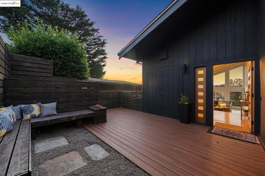 Breathtaking Bay and 3-bridge views frame this striking Montclair contemporary. Designed for modern living with sustainable upgrades, this 4BD/3.5BA home, with ADU, showcases soaring ceilings, walls of glass, and open flow to multiple decks—perfect for entertaining or quiet sunset evenings. The chef’s kitchen is a showstopper with premium appliances, large island, breakfast nook, and seamless indoor-outdoor access.  The primary suite is a serene retreat with fireplace, spa-inspired bath, dual vanities, and private deck. Three bedrooms are conveniently located together, while the versatile lower level—with its own kitchen, bath, laundry, and entry—functions as a guest suite, home office, or creative studio.  Eco-friendly features abound: owned solar, Tesla Powerwall, EV charger, terraced gardens with fruit trees, and a chicken coop. A two-car garage with street-level access and generous storage provide everyday ease. Just minutes to Montclair Village, Hills Swim & Tennis Club, scenic trails, and freeway access for an easy SF/Bay Area commute. A rare blend of style, functionality, and sustainability.