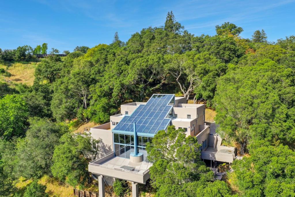 An executive Jong & Jong architectural marvel, this Orinda retreat is as much a statement of vision as it is a home. Imagined by the celebrated Berkeley firm known for blending timeless Japanese design elements with modern California living, its a masterclass in light, proportion, and connection to nature. Anchored by a soaring glass atrium that floods the interiors with daylight, each space flows effortlessly into the next. Shoji-inspired elements and architectural bridges create intimate retreats within a bright, open floor plan, offering the freedom to entertain on a grand scale or slip away into quiet reflection. Set on over an acre of rare privacy, the home features five expansive bedrooms, a versatile upper-level bonus suite, and multiple terraces with front-row views of Orindas golden sunsets and the slow drift of fog over San Pablo Reservoir. The chefs kitchen blends seamlessly into casual living spaces and al fresco dining, complete with built-in BBQ and newly refinished decks. A place to think deeply and host brilliantly. All within minutes of BART, top-ranked schools, and the charm of Orinda Village.