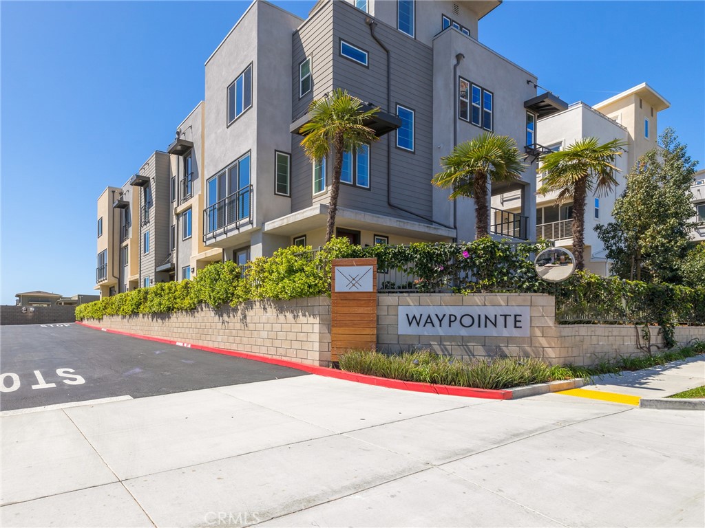 This modern townhome offers an exceptional blend of style, comfort, and breathtaking views. Located in the coveted Waypointe complex, this property features a bright, open floor plan ideal for both relaxing and entertaining. The main living area offers a spacious living room, dining area, and a sleek chef’s kitchen complete with high-end stainless-steel appliances and a large peninsula for additional seating. A cozy balcony just off the dining area provides the perfect spot to enjoy morning coffee or unwind in the evening. The top floor has two private, sun-filled bedrooms, each with its own en-suite bathroom and ample closet space. A stacked laundry area is conveniently located across from the bedrooms. An expansive rooftop terrace offers stunning panoramic views of the city, ocean, and mountains. It’s an ideal space to host guests, enjoy sunset views, or simply relax in the coastal breeze. Additional features include an attached two-car garage with an EV charger, recessed lighting, sleek modern finishes, and additional parking via the community's guest parking spaces. The location is perfectly situated across from a dog park and just minutes from the beach, LAX, and the charming shops and restaurants of downtown El Segundo. This home also benefits from being within a top-tier school district along with being part of the family-friendly Waypointe community. Blending modern design, prime location, and sweeping views, this townhome offers an exceptional living experience.