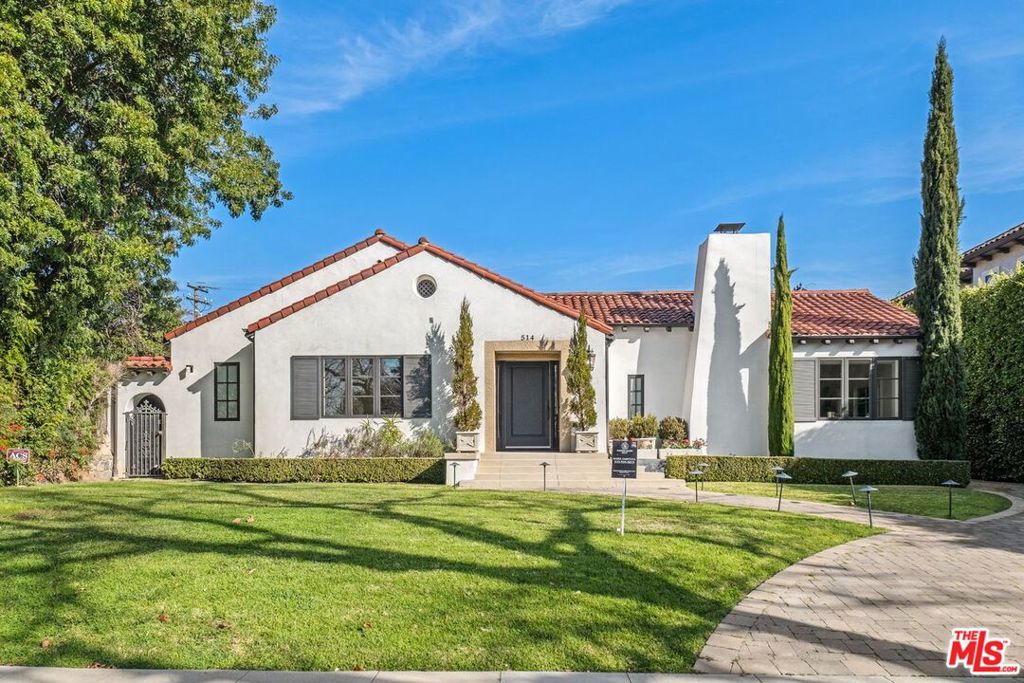 Renovated Spanish-Style Home in Beverly Hills Flats! Beautifully updated Spanish gem in the coveted Beverly Hills Flats, featuring a light-filled interior, formal living room with fireplace, and a gourmet slab-counter kitchen. Three bedrooms include a luxurious primary suite with spa bath, walk-in closets, and yard access. Outdoor highlights include a sparkling pool, elegant seating areas, ample parking, and a garage. Move-in ready to enjoy the best of Beverly Hills living.