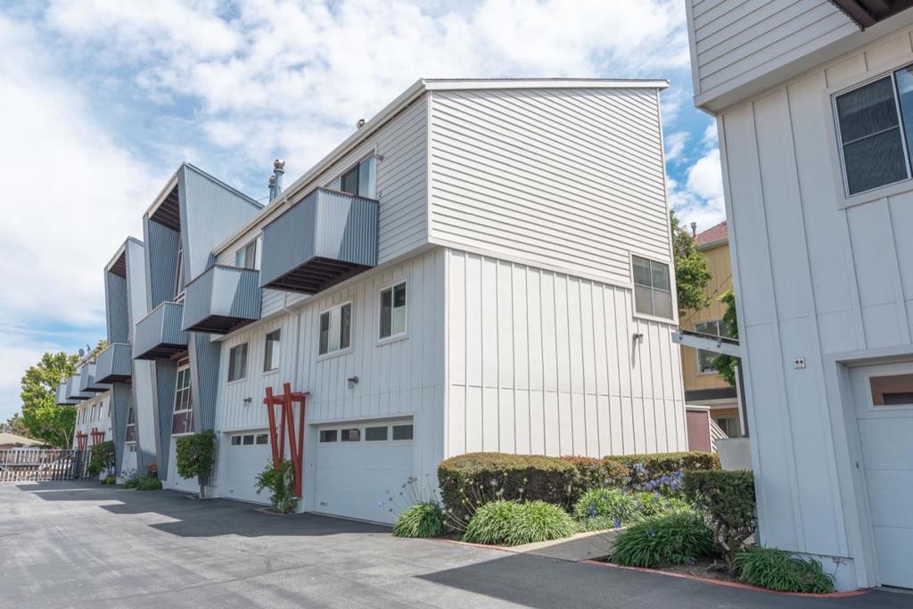 ***NEW PRICE*** Welcome to Ironwood! One of San Mateo's first industrial-modern loft-style reverse floor plan condominiums. 2 Bedrooms and a full Bath downstairs. Top floor has kitchen, living/dining room with high vaulted ceilings and two patio decks. Low monthly HOA dues (only $340)! Wonderfully remodeled a few years ago to include a new kitchen and bathroom, refinished wood floors, new tiles, lights, fixtures and partial double paned windows. End unit - Sharing wall with only one neighbor. No neighbors above or below. Easy drive to Downtown San Mateo, Hillsdale Shopping Center, Trader Joe's, Whole Foods, 25th Ave shops, Hwy 92, and more. Full size high-end LG Washer and Dryer in unit. 2 Car parking - One attached garage space, and one assigned outside space. Avoid the apartment-style living, and enjoy your own private entrance with lots of common area greenery and abundant natural light in unit.