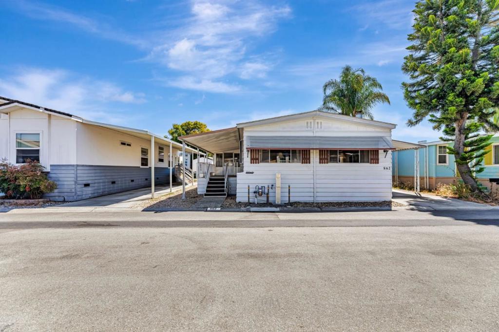 Affordable Home in Desirable Casa de Amigos All-Ages Community. Welcome to this well-maintained home in the sought-after Casa de Amigos community, offering comfort, convenience, and pride of ownership. Featuring 2 bedrooms and 2 baths, this spacious residence boasts a large open floor plan with a bright living room, a separate family room, and an enclosed screen roomperfect for storage, hobbies, or a home office. Enjoy tile countertops, plush carpet throughout, and plenty of natural light. The exterior offers a covered side porch, a large driveway, a patio area, and a low-maintenance yard. Located close to guest parking and the community swimming pool, this home is part of the highly regarded Sunnyvale School District. The prime location offers easy access to Mountain View and Santa Clara, with quick connections to Highways 101, 237, and 85. Youll be just minutes from major tech companies, Levis Stadium, shopping, dining, and public transportation options including VTA and light rail. Dont miss this opportunity to own an affordable home in one of Sunnyvales most desirable all-ages communities! Space rent to new owners $1,445. Best of all, no property tax!!!