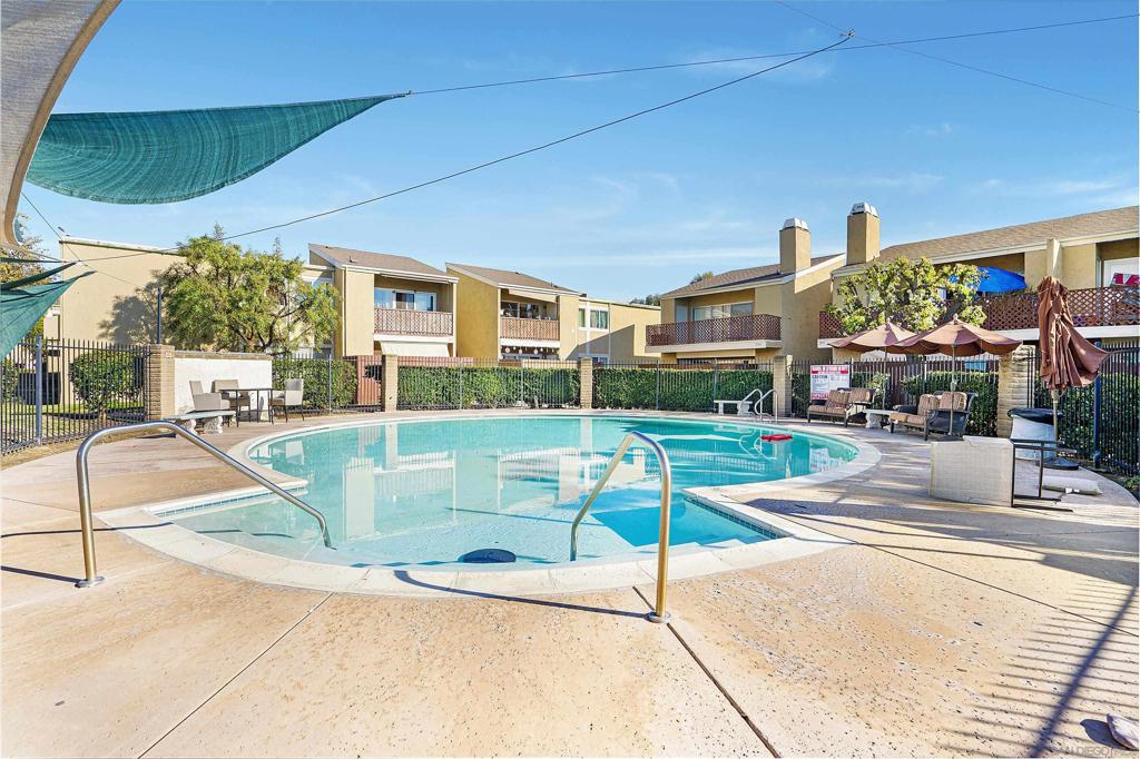 Gorgeous upstairs condo with vaulted ceilings and upgrades throughout! Great location within the gated community, close to numerous amenities, situated in a beautiful park-like setting. The remodeled home features contemporary stone countertops in the kitchen, huge living room with lots of light, all new dual pane floor-to-ceiling windows and a slider to a private oversized patio with extra storage. Living room is equipped with fireplace and opens up into the kitchen, offering refrigerator, microwave, dishwasher and stove. Tile flooring through out provides for easy maintenance and cleaning, both bedrooms are generous size, and one of them features en-suite private bathroom with a tub. Second bathroom is conveniently located in the hallway. Bedrooms provide large closets for your convenience. Home comes with air conditioning, two assigned parking spaces, located close to the unit and washer/dryer hook ups in the patio closet . Community features two pool areas, basketball area, playground and a laundry room. Live in the heart of Escondido, close to shopping areas, restaurants, freeways and more!