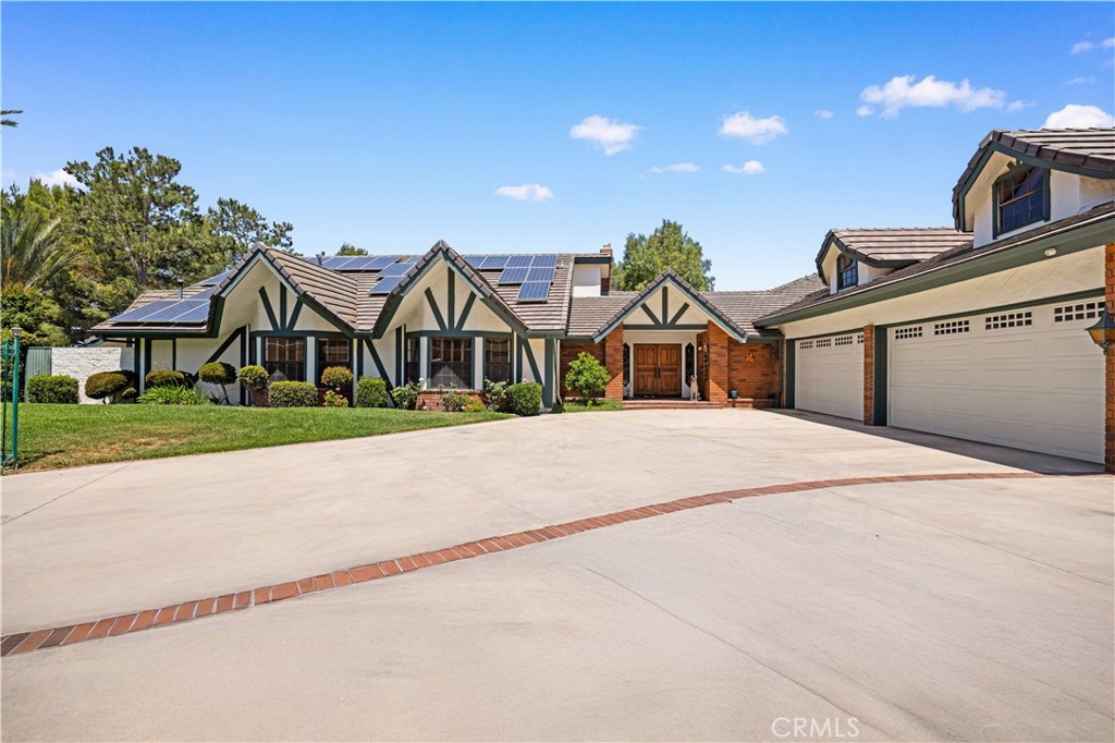 Custom home equipped with Solar panels on a very private gated 1.5 acre lot. 270 degree panoramic view of Mountains, Hills and Valley. Formal living room with marble fireplace and view, large dining room with view, large family room fireplace, view and adjoining study. Spacious kitchen with center island, 2 dishwashers, commercial grade exhaust fan, Jenn-Air 6 burner gas range, Lynx wok burner, Thermador 6 station induction unit and a built-in oversized Electrolux side by side refrigerator/freezer. plus 2 pantries and a large breakfast room with view. 5 spacious en-suite bedrooms and 7 bathrooms. Spacious laundry room with folding tables. the lower level includes an additional 1,300 sqft of space for relaxation with a bar and wine cellar. Beautiful custom pool/spa. Koi pond. Plenty of space outdoors for Children to play and for vegetable gardening, fruit trees and livestock. long private gated driveway with 4 car garage and plenty of space for cars and RV parking. Close and convenient to the Cities of Walnut, Diamond Bar and Rowland Heights and only minutes to Orange County. No Mello Roos or HOA fees.