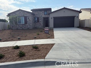 Discover this beautifully designed Multi-Gen home—perfect for extended living or flexible space needs! This must-see residence features an inviting private entry, a spacious great room, and a gourmet kitchen with white cabinetry, quartz countertops, built-in micro-oven and refrigerator, a walk-in pantry, and a large center island ideal for entertaining. Enjoy an open dining area and a luxurious primary suite complete with a generous walk-in closet and private bath. Additional highlights include a convenient laundry room, a covered patio for outdoor living, and a 3-car tandem garage. Ceiling fans are included in all bedrooms for year-round comfort.