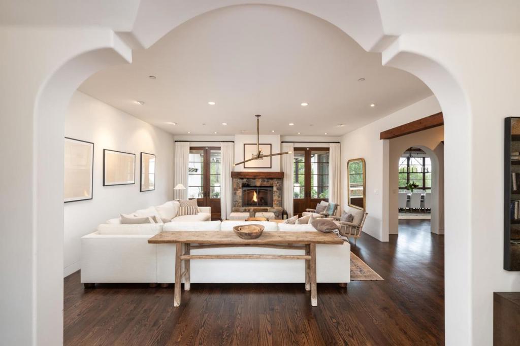 Nestled on a gorgeous virtually flat half acre this stunning Mediterranean style home is surrounded by the pristine beauty of the adjacent Blue Oaks open space, with VIEWS stretching across the East Bay to the glittering Oakland skyline. Masterfully built in 2011 the homes thoughtful design marries a spacious, versatile floor plan with exquisite details: soaring reclaimed wood beams, graceful arched plaster doorways, a classic clay tile roof, and vibrant tile accents, including handcrafted stair risers that add a touch of old-world charm. Expansive custom windows and doors frame the idyllic setting flooding the interior with natural light and seamlessly connecting to the rear deck open and sparkling newly built POOL (2023). This property truly offers the best of everything ! A tranquil retreat in a great neighborhood, just minutes to local shopping, commute routes, Stanford and the award winning Portola Valley schools !