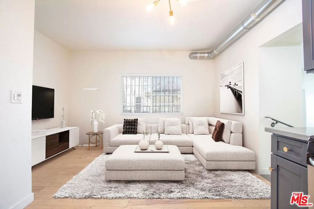 Located in Echo Park, this completely remodeled two-bedroom unit is perfect for the young professional looking for some extra space or for roommates looking to live on a developing portion of Sunset Blvd. With new restaurants and creative local small businesses popping up and down Sunset, this apartment is perfectly located for people interested in abandoning their cars and walking to their favorite bar, restaurant, or shop. This 2nd-floor unit has new stainless steel appliances, an ice & filtered water dispenser, a dishwasher, an in-unit washer and dryer, quartz counter tops, a tiled shower & bathroom, and a glass shower enclosure. There's plenty of room for a working professional or a couple looking to have their own space & still be part of a vibrant neighborhood. The building's exterior features a three-story mural by famed artist Jules Muck.