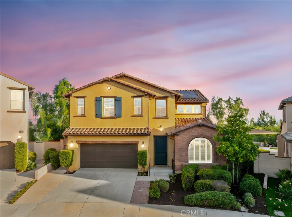 Located on one of the most desirable elevated lots in the gated community of Roripaugh Ranch, this home offers over 90 linear feet of unobstructed southern views, ultimate privacy, and room to add a future pool—making it hands down the best lot in the neighborhood. Spanning just under 3,200 sq. ft., this sought-after 2nd Gen floorplan features a rare downstairs attached casita with its own private entrance. Designed as a fully functioning apartment, the casita includes a living room, bedroom, wet bar with under-counter refrigerator, built-in microwave, and its own stackable washer/dryer.
Inside the main residence, brand-new LVP flooring extends throughout the downstairs. Off the entry is a private office, while the open-concept layout showcases a chef’s kitchen with a large central island, granite countertops, stainless steel appliances, and a double oven. The kitchen flows seamlessly to the dining area and great room, both offering direct access to the covered California room with a built-in fireplace—perfect for indoor/outdoor living and entertaining.
Upstairs, you’ll find a spacious loft, laundry room, and two secondary bedrooms with a shared bath. The luxurious primary suite is a true retreat, highlighted by three oversized windows framing the breathtaking views, a spa-like bath with dual sinks, soaking tub, walk-in shower, and an expansive walk-in closet.
Living in Roripaugh Ranch means enjoying resort-style amenities including a clubhouse, 24/7 fitness center, pool and spa, tennis and basketball courts, newly added pickleball courts, two parks, and private walking trails. This is a rare opportunity to own a premier view lot and a versatile multigenerational home in one of Temecula’s most sought-after communities.