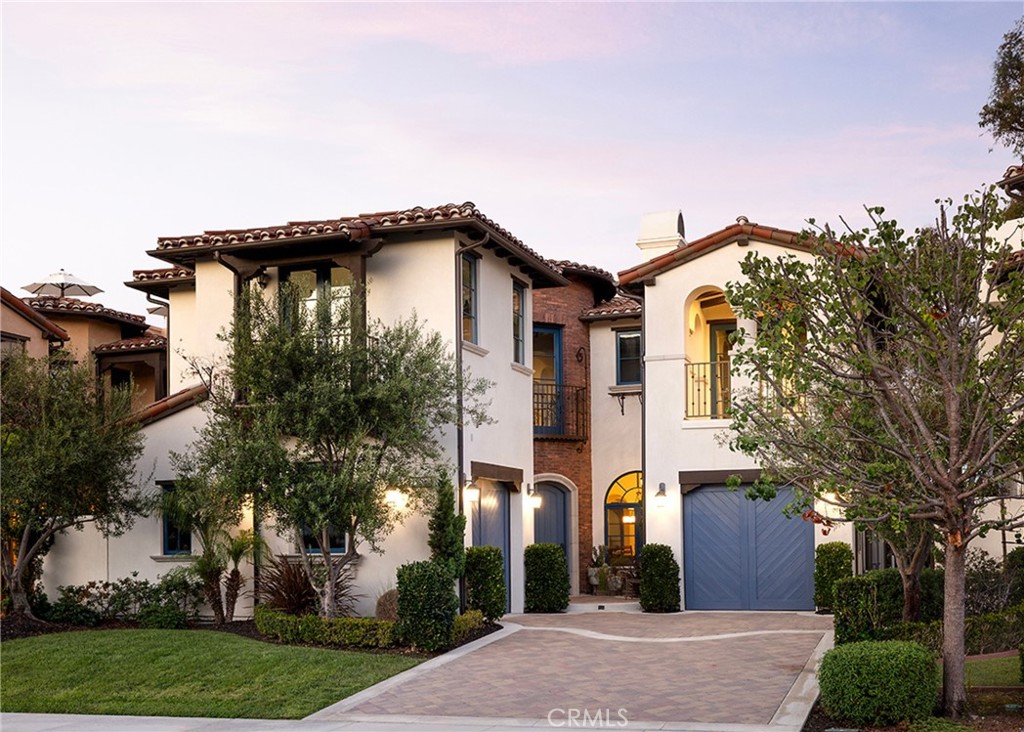 Set high above the shoreline in the private enclave of Ocean Del Rey Estates, 35209 Del Rey embodies the essence of coastal Mediterranean design—where craftsmanship, comfort, and endless views converge. One of just ten residences in this gated cul-de-sac, the estate spans approximately 3,944 square feet, offering 5 bedrooms and 5.5 baths across three levels of considered living. Inside, hardwood and limestone floors ground the interiors, while imported tile and Venetian plaster walls add texture and tone. Soaring ceilings, arched doorways, and hand-scraped beams frame rooms filled with California light. The kitchen—anchored by Thermador professional appliances—blends form and function, opening to the family room and breakfast nook for everyday gathering, while separate dining and living rooms offer space for celebrations and quiet evenings alike. The primary suite is both grand and intimate: vaulted ceilings, a fireplace, a private balcony for morning coffee, and a spa-like bath complete with dual vanities, soaking tub, and walk-in shower. Each secondary bedroom offers a retreat of its own, including Jack-and-Jill suites designed with comfort in mind. The lower level adds a rare dimension—an ensuite bedroom, additional bath, and private exterior access—perfect for extended family, guest quarters, or a secluded home office. Beyond the interiors, life unfolds outdoors. A private backyard invites gatherings with its built-in BBQ and shaded alcoves, while the rooftop deck becomes its own destination—complete with fireplace, panoramic Catalina views, and skies that move seamlessly from sunrise to sunset. From Fourth of July fireworks on the horizon to leisurely strolls to nearby beaches, shops, and parks, every moment is framed by the effortless rhythm of Capistrano Beach living. Modern conveniences enhance timeless architecture: smart home integration, zoned climate control, central vac, whole-house water filtration, and integrated sound. Spanish-tiled staircases, Mediterranean curves, and custom finishes ensure beauty is felt in both the smallest and grandest details. More than a residence, 35209 Del Rey is a vantage point, a retreat, and an invitation to inhabit the quiet luxury of life by the sea.