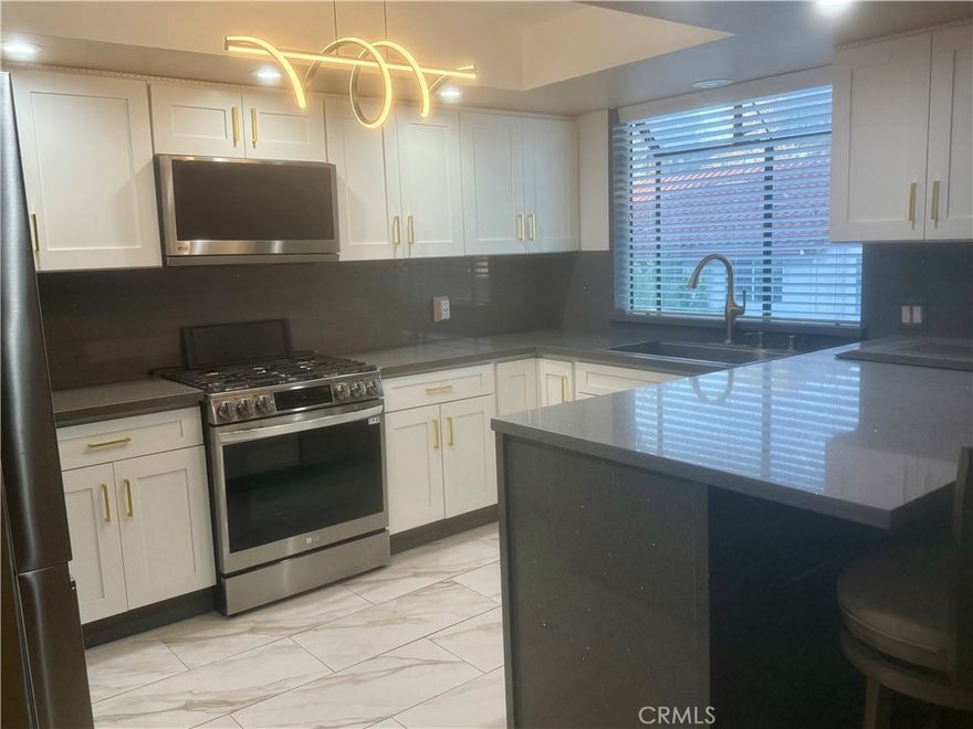 Welcome to this 1566 soft modern stunning  2+2.5 remodeled townhome 0n the heart of Tarzana, Gate community, This beautiful maintained  unit offersunique blend of comfort and luxury. Light and bright living room with fire place, high ceiling ,oversized sliding doors opening to a patio. great size kitchen featuring Quartz counter tops lots of cabinet space stainless steel appliance Ref stove oven microwave and dishwasher. Master suit with double sink  vanity and  big walking closet  fire place and balcony . Dinning room include wet bar  This community is located close to Ventura Blvd shops and restaurants and free way. Community with pool and spa. come and see this modern unit.