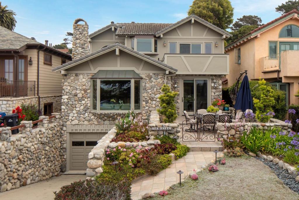 Located just one block from Carmel Beach and an easy stroll to downtowns world-class restaurants and shops is Sea Haven. Step inside to an open living/dining area with vaulted ceilings and easy access to the kitchen with a clean, beachy/modern aesthetic. The house offers three bedrooms with three full baths, plus a spacious family room just off the two-car garage, which could be ideal for a variety of uses. The upstairs master suite promises the best ocean views on the property, the deck offering an ideal place to watch the sunsets or time the surf. The property takes full advantage of its 4,000 square foot lot, with beautiful landscaping in the front yard leading to a spacious patio with southwestern exposure and the sights and sounds of the neighborhood and nearby sea, complemented by a more secluded backyard accessible from the kitchen offering a private space to relax and entertain. With a little bit of everything, this is the have-it-all beach retreat.