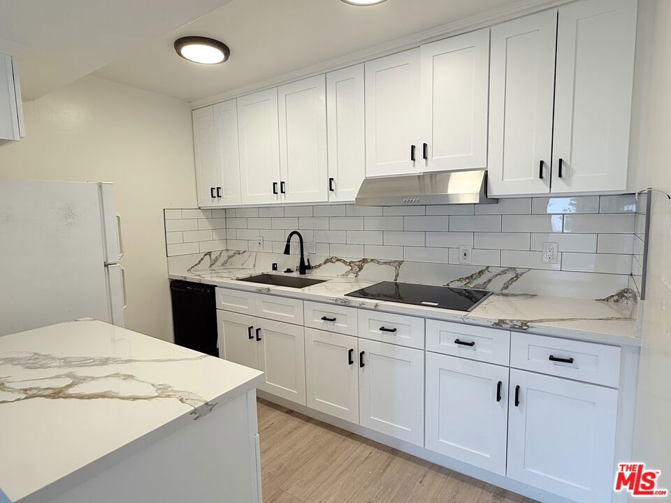 Fully remodeled 2 Bedroom 2 Bathroom townhome. Stylish kitchen with quartz countertops new cabinets. New bathrooms with quartz countertops, tile showers and glass shower doors. Double pane windows and double pane sliding glass doors throughout. Ceiling fans. AC in Living room and primary bedroom. Spacious carport, with stairs leading to the unit. Private Washer and Dryer in the garage. Cable TV and internet ready. Primary Bedroom with 2 walk-in closets. Guest Bedroom with large walk-in closet. Don't miss out on this stylish remodeled unit! Schedule a tour today. Small dog or cat allowed with written approval.