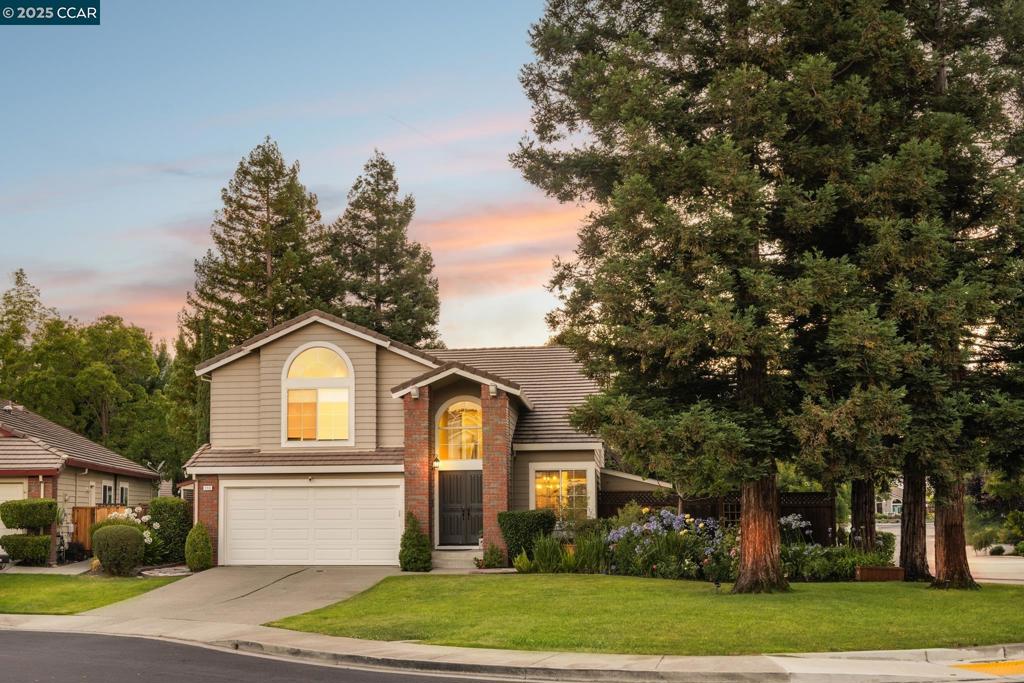 Private and east-facing, this newly renovated home sits on a desirable corner lot in San Ramon's sought-after Bent Creek neighborhood. Tucked away on a peaceful court lined with majestic redwoods, it offers both privacy and serenity. Step inside to find luxurious engineered hardwood floors, soaring ceilings, and fresh interior paint. A newly redesigned staircase with modern railings adds a stylish touch. New carpet warms the bedrooms, while sleek tile enhances the bathrooms. The formal living and dining areas flow seamlessly—perfect for entertaining. The fully remodeled kitchen boasts white cabinetry, granite countertops, built-in appliances, and a center island with bar seating. A sunny breakfast nook connects to the spacious family room, ideal for daily living. A main-level bedroom and full bath offer flexibility for guests or multi-gen living. Upstairs, the oversized primary suite features vaulted ceilings, a large closet, and a spa-like bath with double sinks, jetted tub, and walk-in shower. Secondary bedrooms share a Jack-and-Jill loft with custom built-ins—ideal for study or play. Extras include custom light fixtures, a whole house fan, lush backyard lawn, side yard with hot tub, and close proximity to trails, freeways, and recreation.